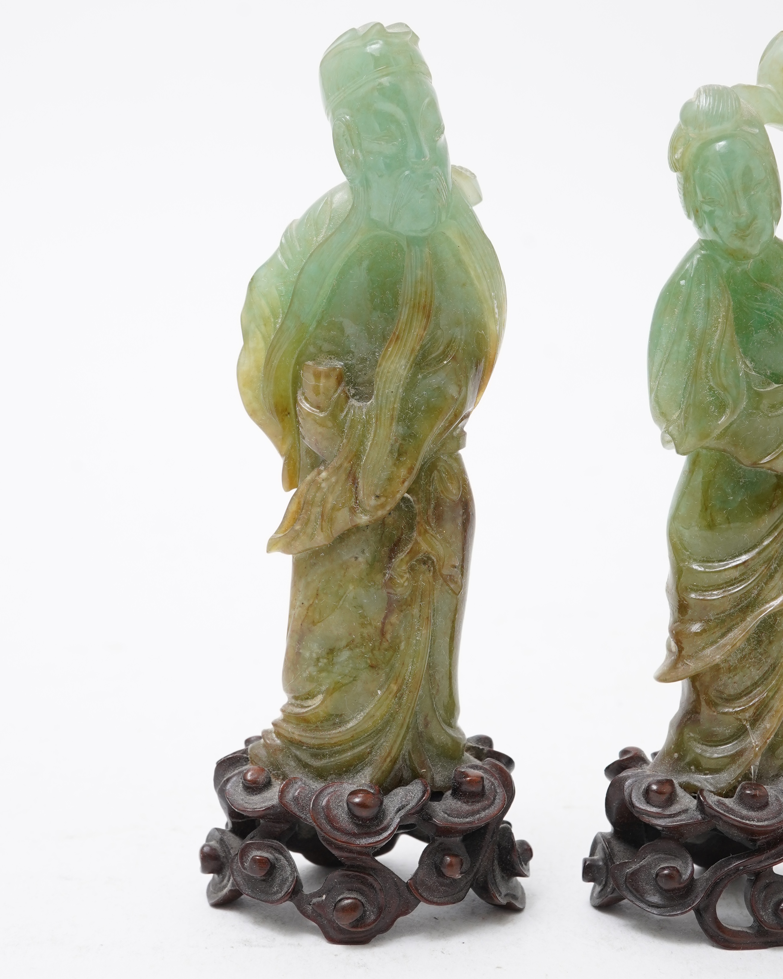 Possibly retailed by Cartier, a pair of Chinese jadeite figures, early 20th century